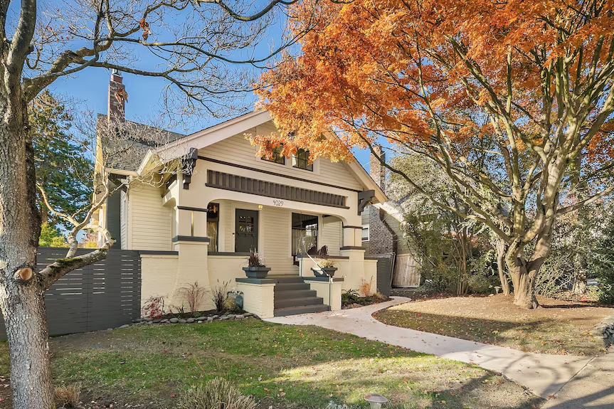 Wallingford's classic early-1900s craftsman homes are defined by their deep setbacks and the massive, mature street trees that line the neighborhood.